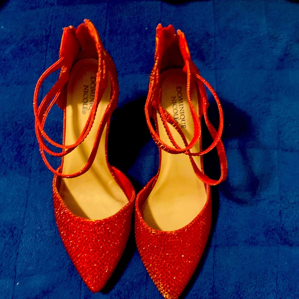 A pair of red Dominique Nicole’s
